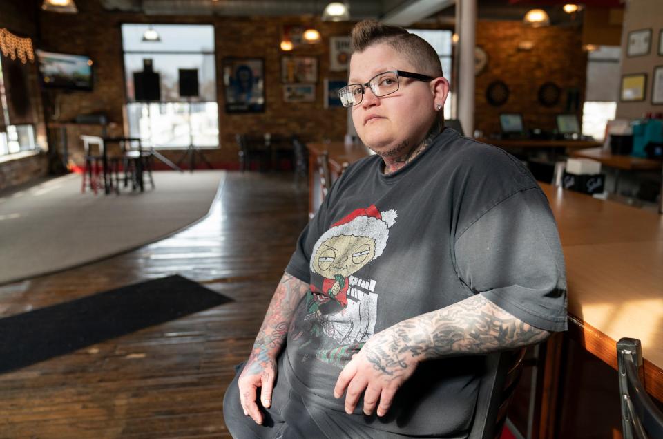 Sir Pizza in Old Town Lansing co-owner Danelle Admire, 38, is an undecided voter for the 2024 election. Admire sits for a portrait on Monday, March 25, 2024.