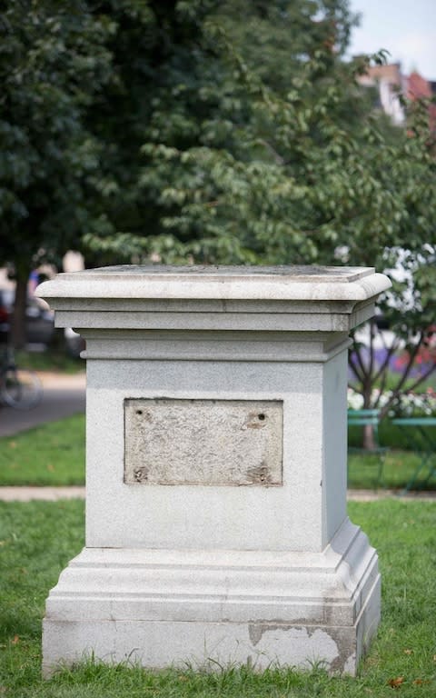 The Roger B. Taney monument base in Mount Vernon Place is viewed in Baltimore, Maryland, after it was removed by the city on August 16, 2017 - Credit: AFP