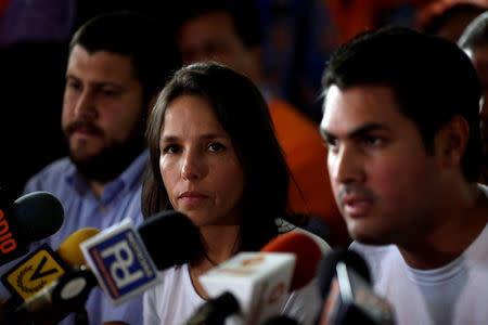 Antonietta Ledezma, daughter of opposition leader Antonio Ledezma, looks on as her brother Victor speaks during a news conference at the Venezuelan coalition of opposition parties (MUD) headquarters in Caracas, Venezuela August 1, 2017. REUTERS/Ueslei Marcelino