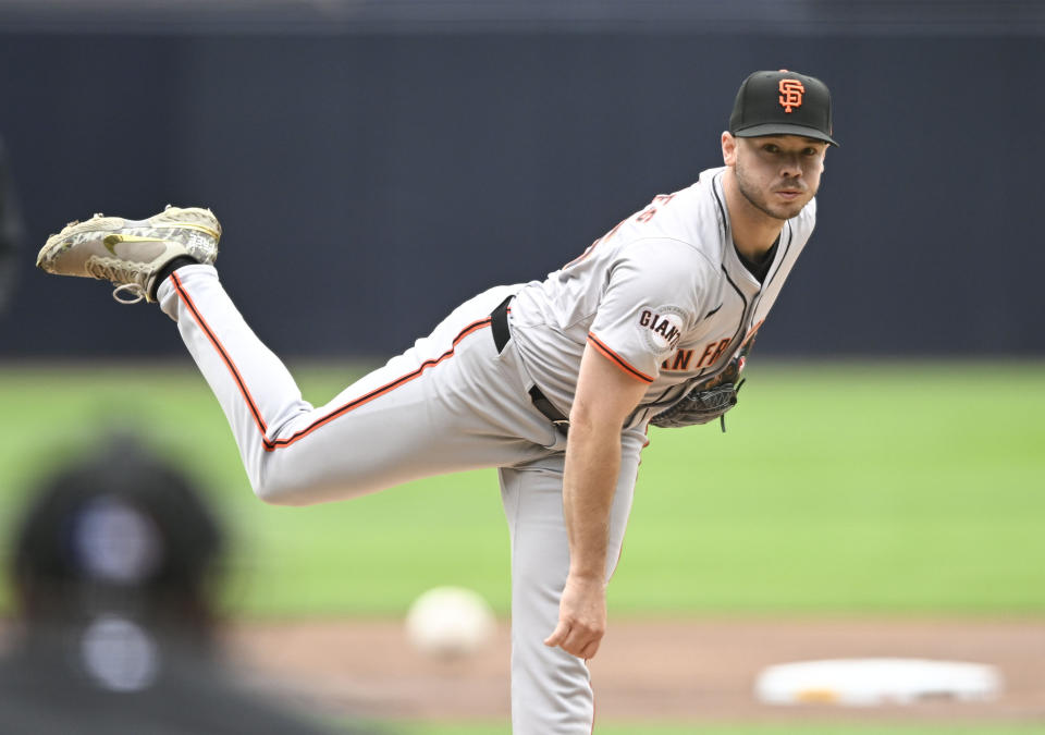 San Francisco Giants starting pitcher Daulton Jeffries watches a throw during the first inning of the team's baseball game against the San Diego Padres, Sunday, March 31, 2024, in San Diego. (AP Photo/Denis Poroy)