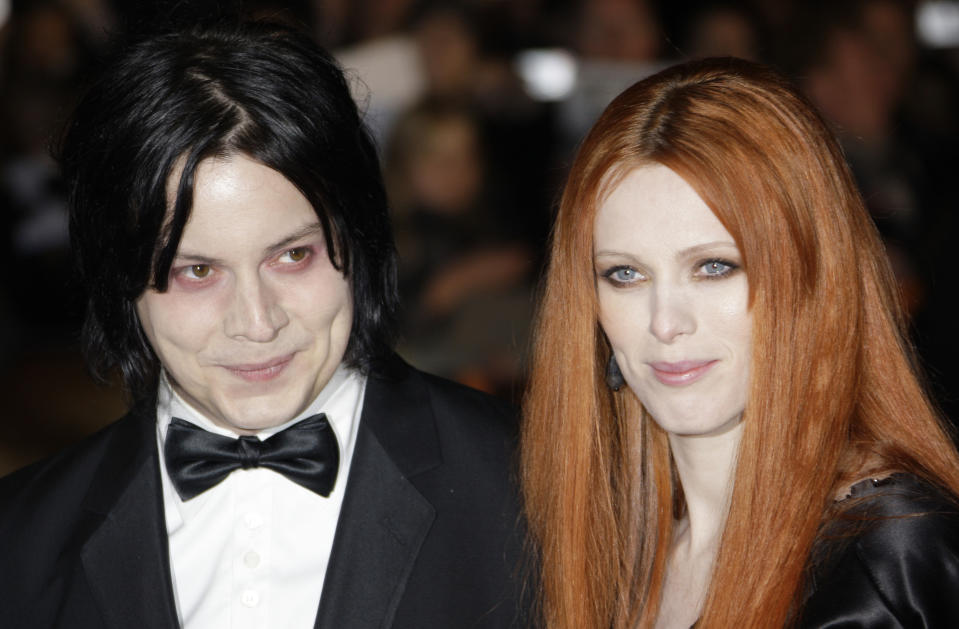 FILE - In this Oct. 29, 2008 file photo, musician Jack White, left, and Karen Elson arrive on the red carpet for the Royal World Premiere of the 22nd James Bond film, "Quantum of Solace" in London. Elson filed a restraining order against White after she said in their divorce filings he was threatening her and she fears for her safety and her children's. Elson filed for a temporary restraining order July 17. It was approved by a judge pending a court hearing on Aug. 29. (AP Photo/Joel Ryan, file)