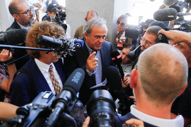 Former soccer officials Sepp Blatter and Michel Platini face corruption charges in Swiss trial