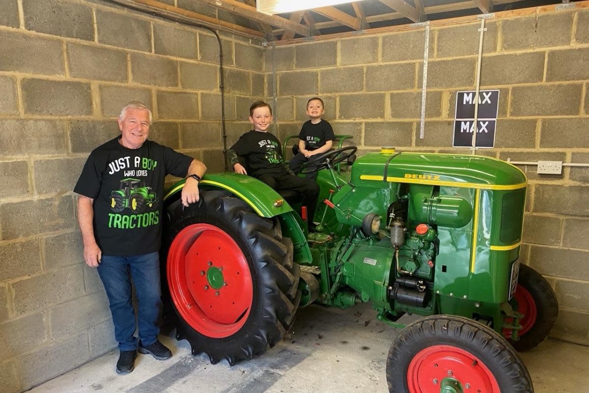 Bill Moody and his grandsons Max and Joseph on board the Deutz FL14 <i>(Image: Tractor Fest)</i>