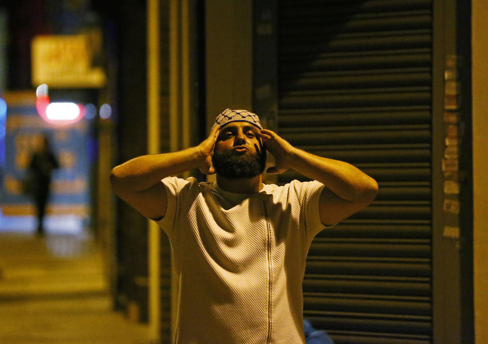 <p>A man prays after a vehicle collided with pedestrians near a mosque in the Finsbury Park neighborhood of North London, Britain June 19, 2017. (Neil Hall/Reuters) </p>