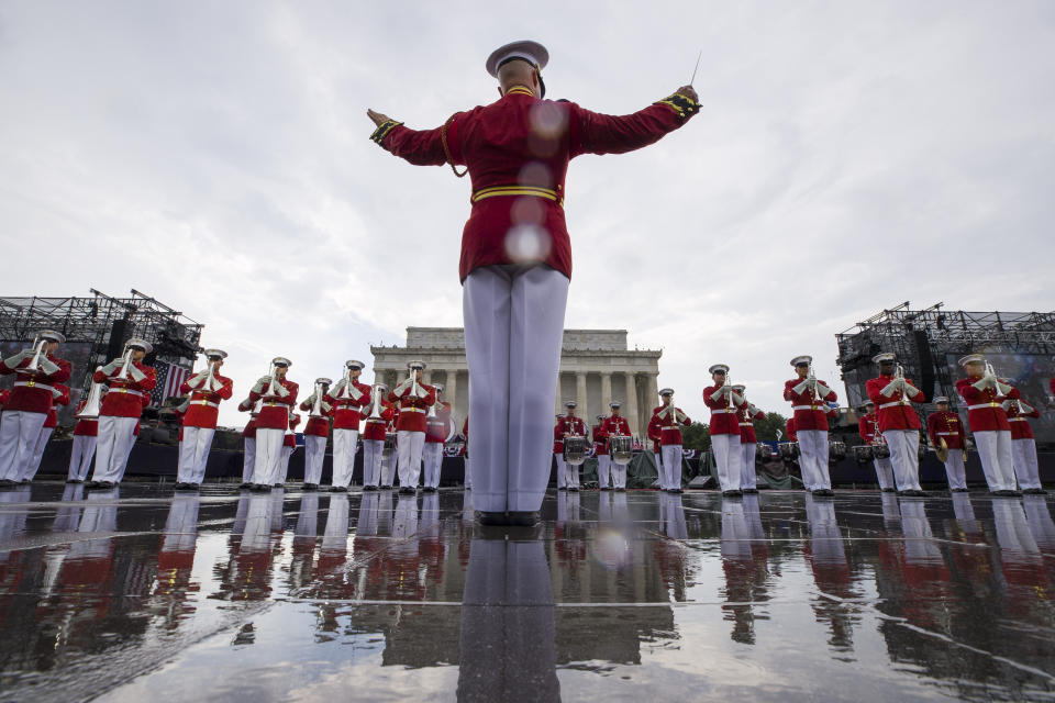 The U.S. Marine Corps Drum and Bugle Corps performs in the rain during an Independence Day celebration in front of the Lincoln Memorial, Thursday, July 4, 2019, in Washington. (AP Photo/Alex Brandon)