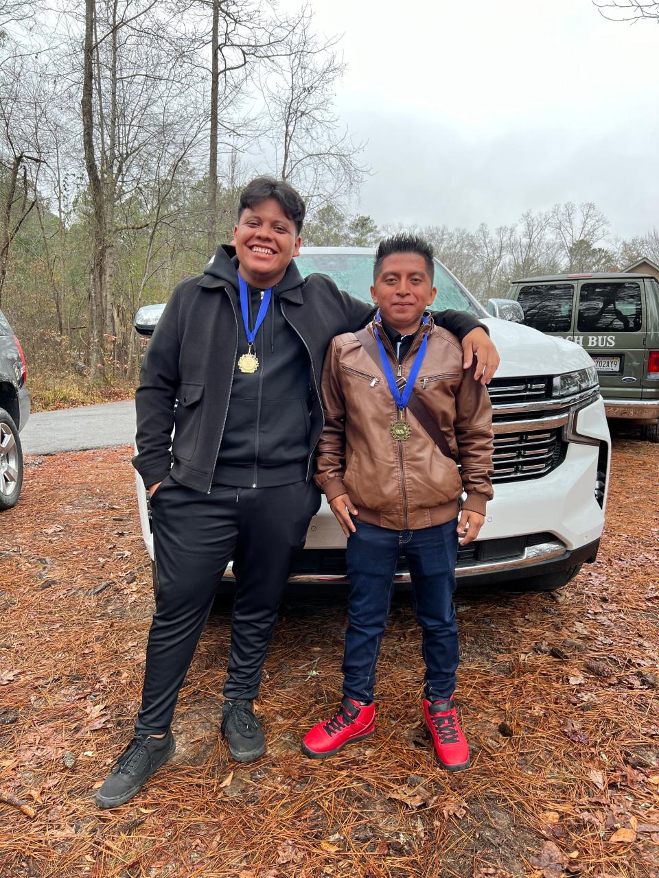 Victor Ixcoy, left, poses for a photo with Santos Tiul-Chen, right on Dec. 17, 2023.Tiul-Chen drowned in the Caloosahatchee River on Saturday, May 18, 2024.