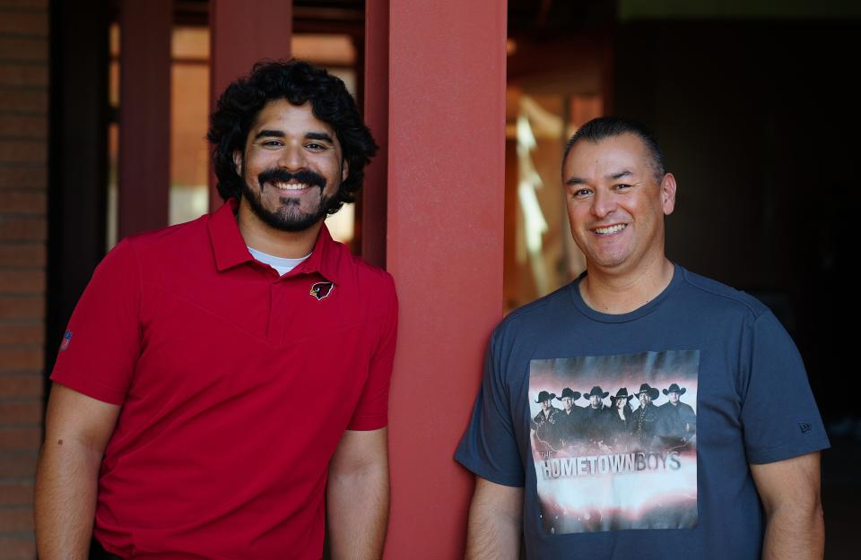 José Romero, Cardinals commentator (L) and José Romero, Arizona Republic sports reporter, pose for pictures at the Cardinals Training facility in Tempe on Sept. 13, 2022.