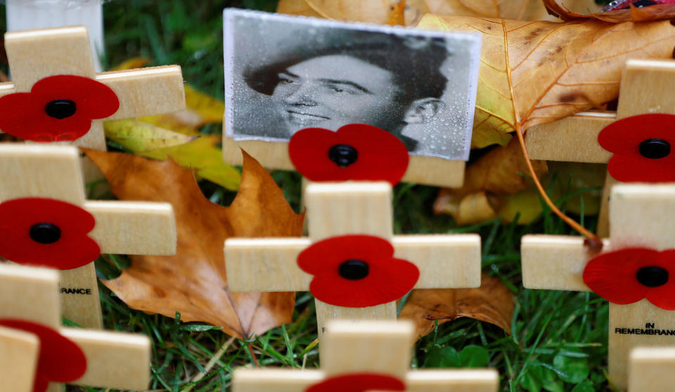 <p>A photograph of a military veteran is attached to a wooden cross in the Field of Remembrance in London, Britain, Nov. 11, 2017. (Photo: Peter Nicholls/Reuters) </p>