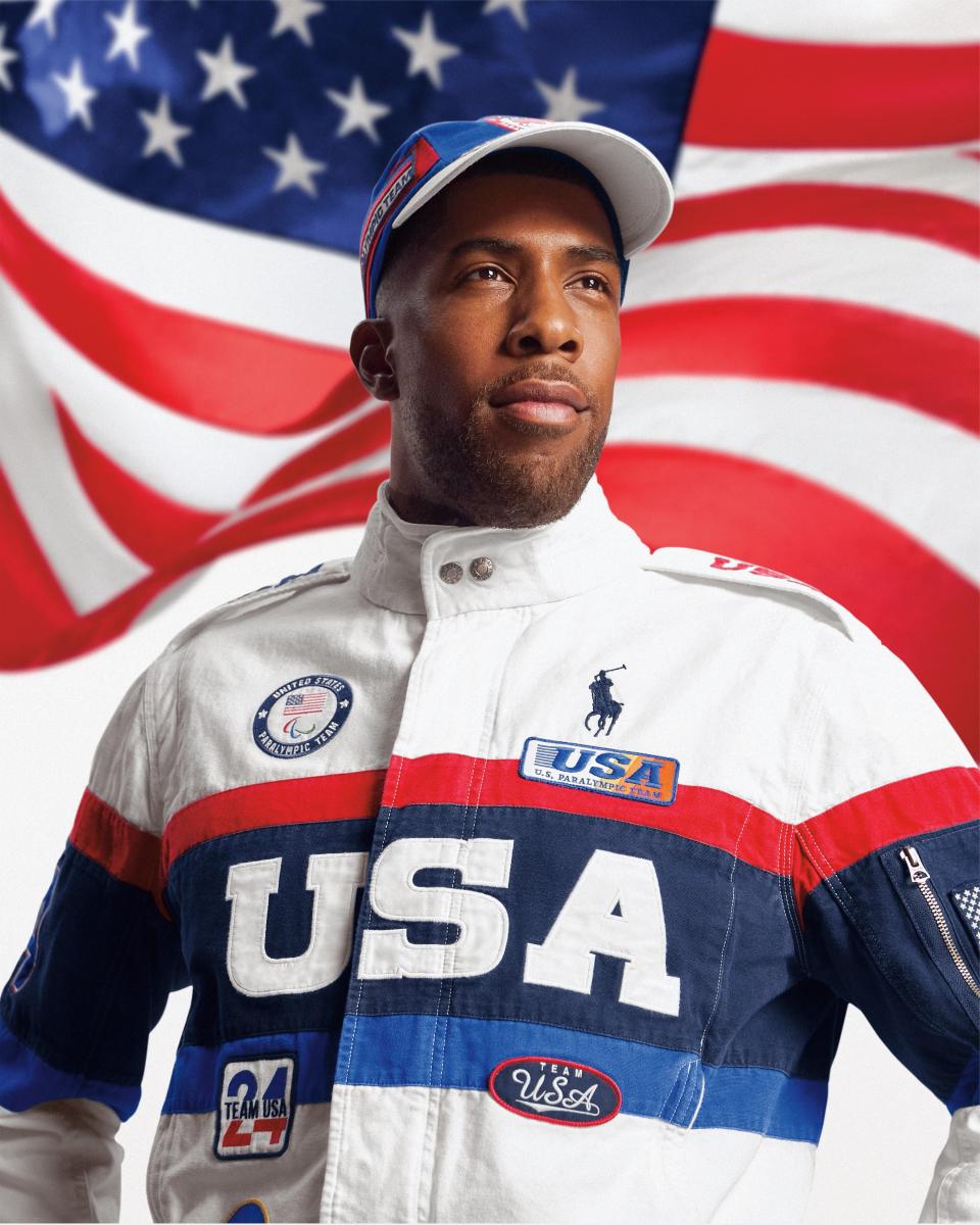 Jamal Hill models the closing ceremony jacket from Ralph Lauren for the 2024 Paris Olympics.