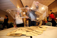 Ballot boxes are emptied as officials start counting the votes in the second round of the 2017 French presidential election at a polling station in Tulle, France May 7, 2017. REUTERS/Regis Duvignau