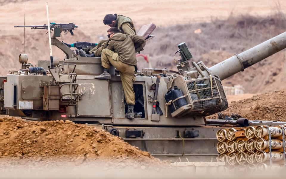 Israeli soldiers prepare for the scenario of ground maneuvers at an undisclosed location near the border with Gaza, in Israel,