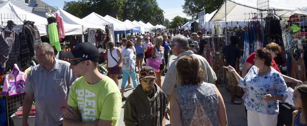 A large crowd checks out the goods at the street art fair during a past Shanty Days in Algoma. The annual weekend-long community festival is among the events sponsored by the Algoma Area Chamber of Commerce, which was awarded a $10,000 grant from the state to use on its Friendly Algoma Visitor Guide to promote its offerings to tourists.