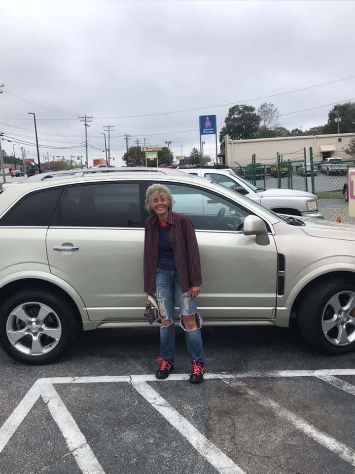 Darlene Quinn is pictured posing in front of her new car. Source: Facebook 