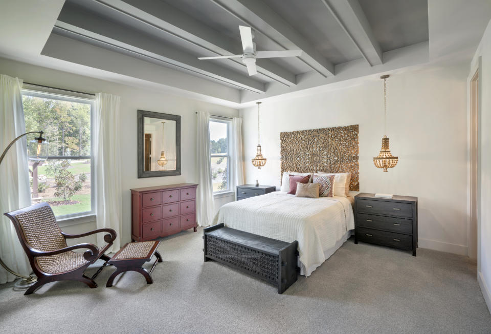 This photo provided by Ashton Woods shows a residential bedroom with a painted beam ceiling in the Ashton Woods Ridgefield Farms community in Raleigh, N.C. (William Taylor/Taylorphoto/Ashton Woods via AP)