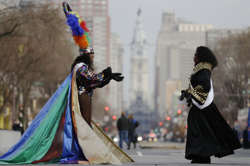 Members of the Mummers LGBT Liaison Committee wait for the start of the annual New Year's Day parade, in view of City Hall, Wednesday, Jan. 1, 2014, in Philadelphia. (AP Photo/Matt Rourke)