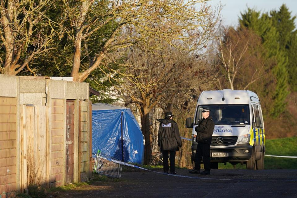 Police at the scene on Broadlands, Netherfield, Milton Keynes (PA)