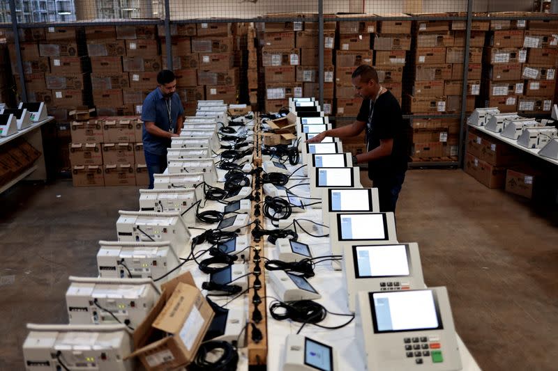 FILE PHOTO: Electronic voting machines are prepared to be used in the first round of Brazilian presidential elections, in Brasilia