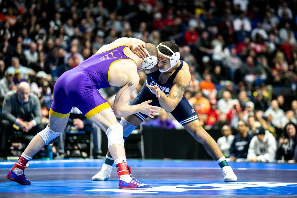 Penn State's Aaron Brooks, right, faces Northern Iowa's Parker Keckeisen at 184 pounds in the finals of the NCAA Division I Wrestling Championships in Tulsa, Okla. Brooks won by decision, 7-2, for his third straight national title.