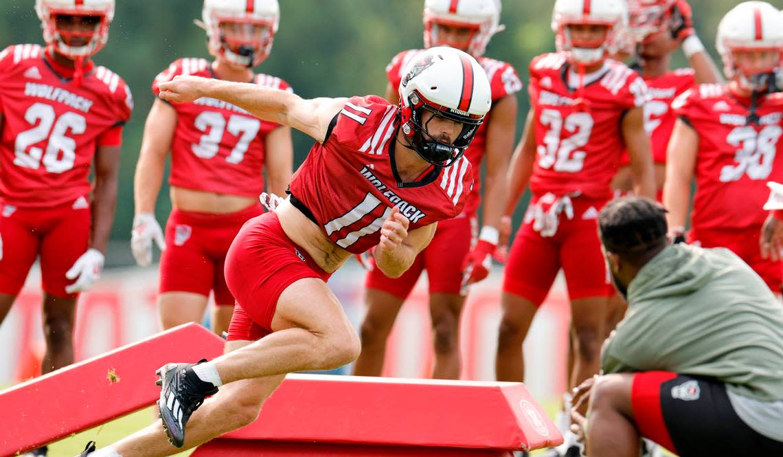 N.C. State linebacker Payton Wilson (11) runs a drill during the Wolfpack’s first fall practice in Raleigh, N.C., Wednesday, August 2, 2023. Ethan Hyman/ehyman@newsobserver.com