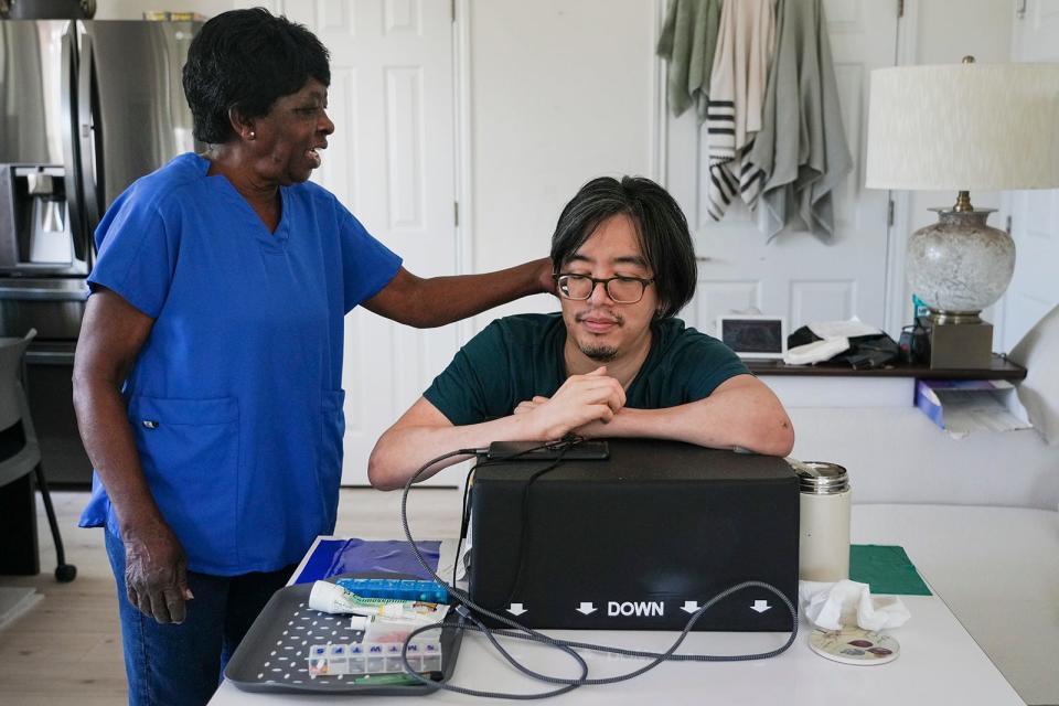 Shirley Eason provides care for Tommy Dang for 22 hours a week. Dang relies on Eason for almost everything because he has been unable to find a second attendant to provide the other 18 hours a week of care he needs.