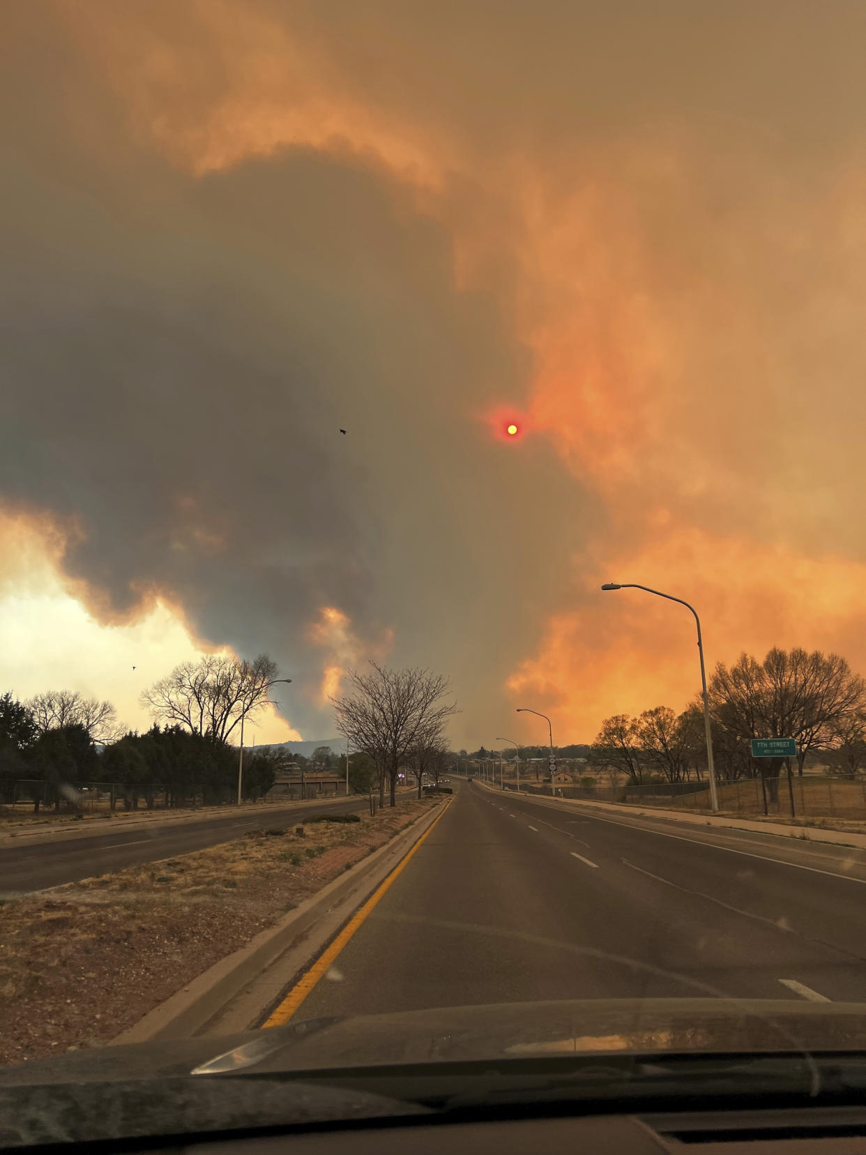 This photo provided by Renee Valdez shows plumes of smoke rising into the air, from wildfires in Las Vegas, N.M. on Monday, May 2, 2022. New Mexico was in the bull's eye for the nation's latest wave of hot, dry and windy weather. (Renee Valdez via The AP)