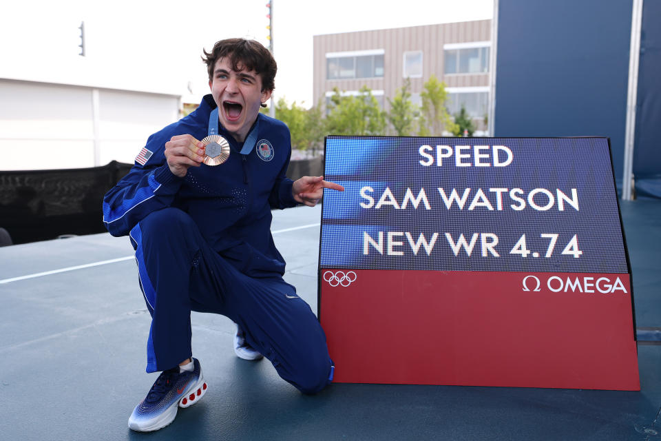 PARIS, France - August 8: Bronze medalist Sam Watson of Team United States poses next to a screen with his world record time of 