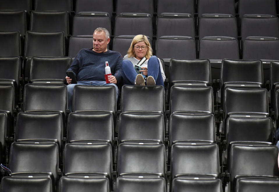 Fans sit in an empty section after the Jazz-Thunder game was postponed. (Kyle Phillips/AP Photo)