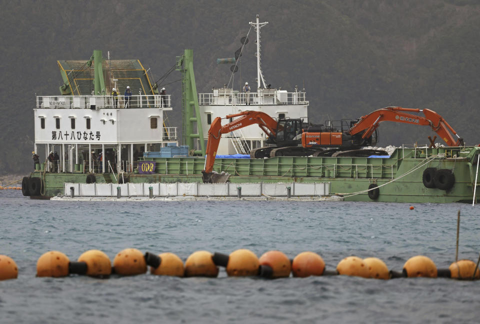 A reclamation work is resumed at a construction site off Henoko in Nago, Okinawa prefecture, southern Japan Wednesday, Jan. 10, 2024. Japan's central government on Wednesday forcibly resumed reclamation work at the planned relocation site of a disputed U.S. military base on the southern island of Okinawa despite persistent opposition and protests by residents and amid growing international criticisms that the move tramples on democracy and environment. (Kyodo News via AP)