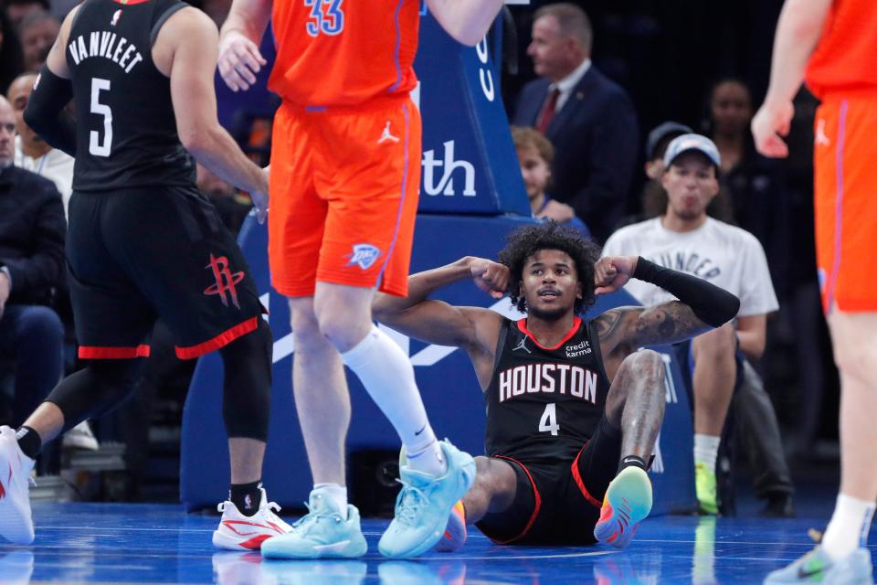 Rockets guard Jalen Green (4) celebrates after getting fouled and making a basket during Houston's 132-126 overtime win against the Thunder on Wednesday at Paycom Center.