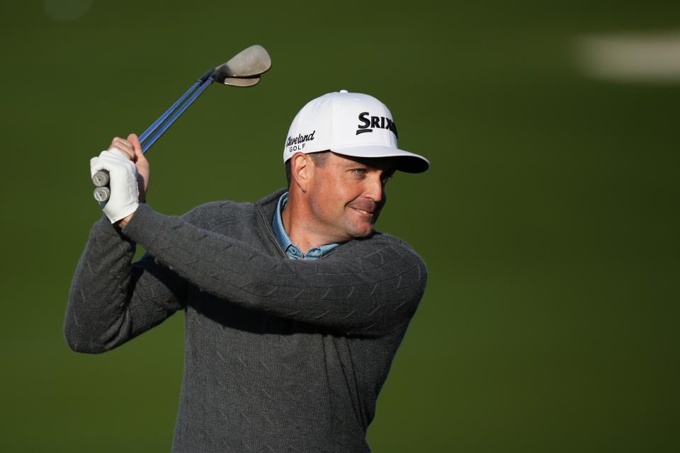 Keegan Bradley stretches on the driving range during a practice round in preparation for the Masters golf tournament at Augusta National Golf Club Monday, April 8, 2024, in Augusta, Ga. (AP Photo/Matt Slocum)