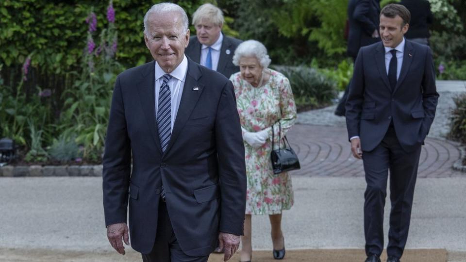 French President Emmanuel Macron, Queen Elizabeth II, British Prime Minister Boris Johnson and United States President Joe Biden arrive at a drinks reception for Queen Elizabeth II and G7 leaders at The Eden Project during the G7 Summit on June 11, 2021 in St Austell, Cornwall, England.