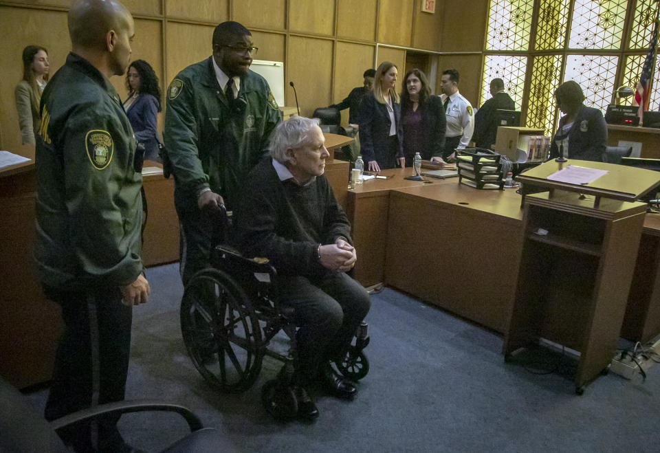 Robert Koehler, who authorities call the "Pillowcase Rapist," is wheeled out of the courtroom by a Miami-Dade Corrections and Rehabilitation Department officer after he was found guilt by a jury in his trial, Wednesday, Jan. 25, 2023, in Miami. (Jose A. Iglesias/Miami Herald via AP, Pool)
