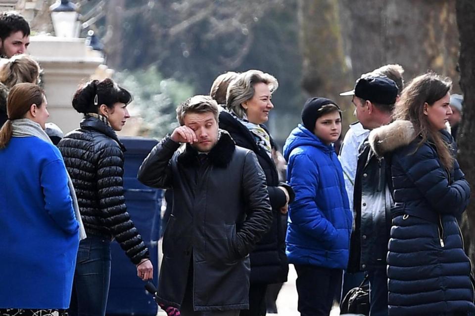 Russian diplomats and family members leave from the Russian Embassy in central London (EPA)