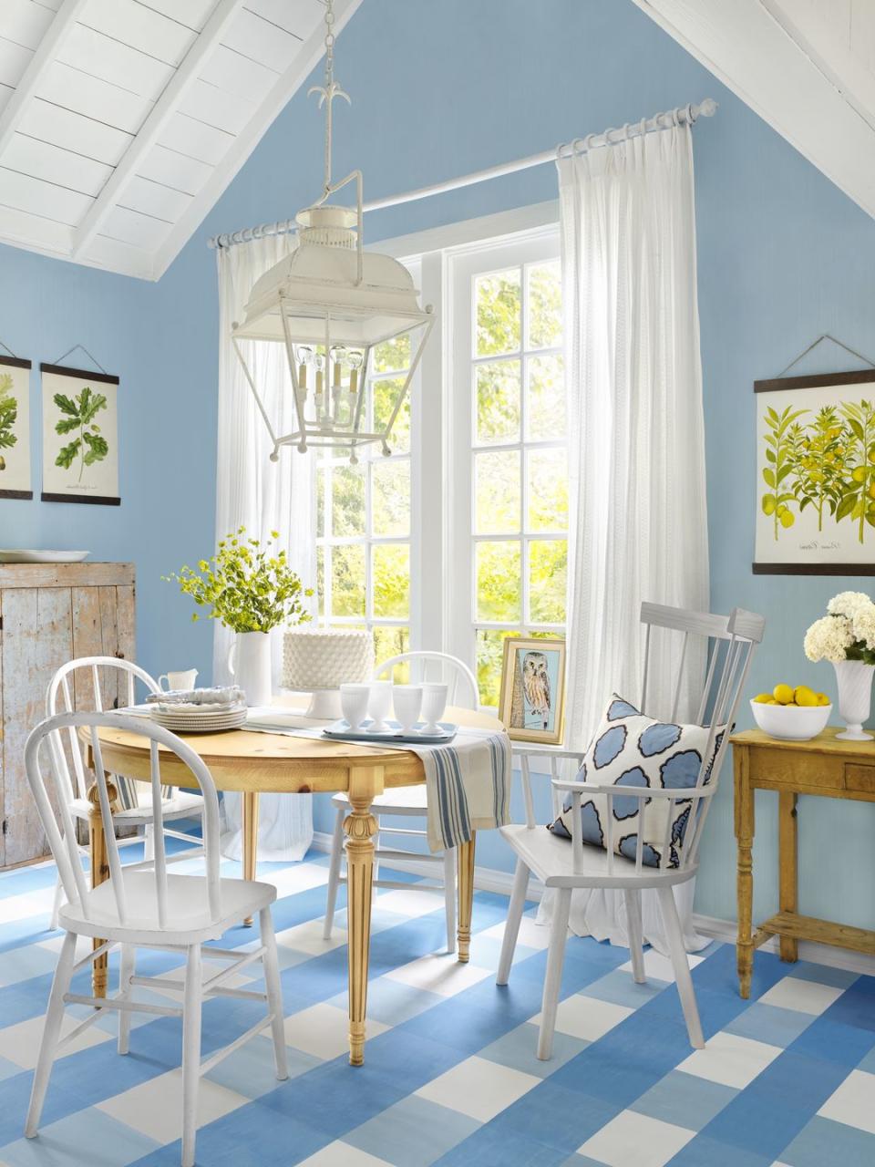 <p>Embrace a classic country blue-and-white color palette from ceiling to floor—literally. In this breakfast nook, plaid painted floors set the tone for the rest of the freshly decorated room. </p>