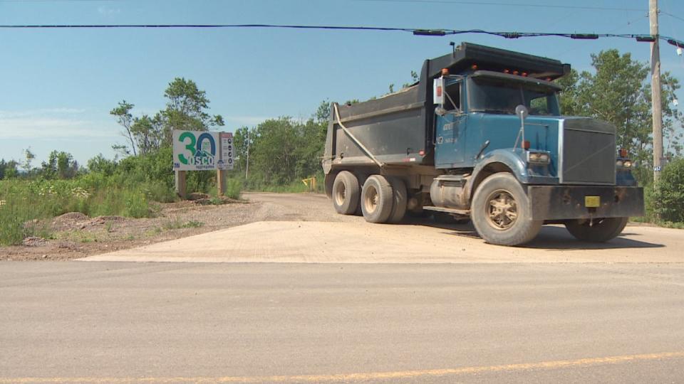 A truck pulls out from OSCO Aggregates Ltd. on June 27, 2024.