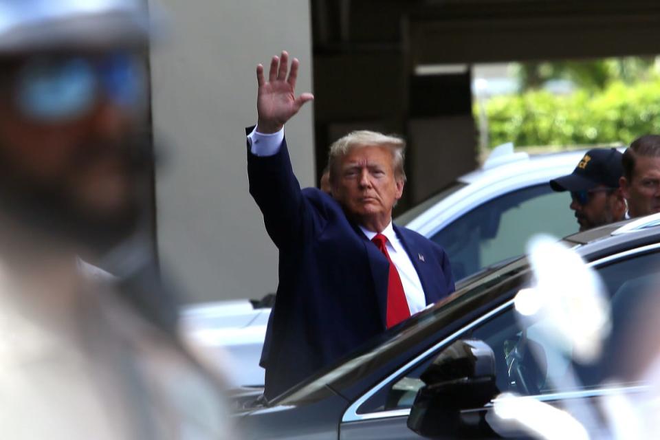 <div class="inline-image__caption"><p>Trump waves as he makes a visit to the Cuban restaurant Versailles.</p></div> <div class="inline-image__credit">Alon Skuy/Getty</div>