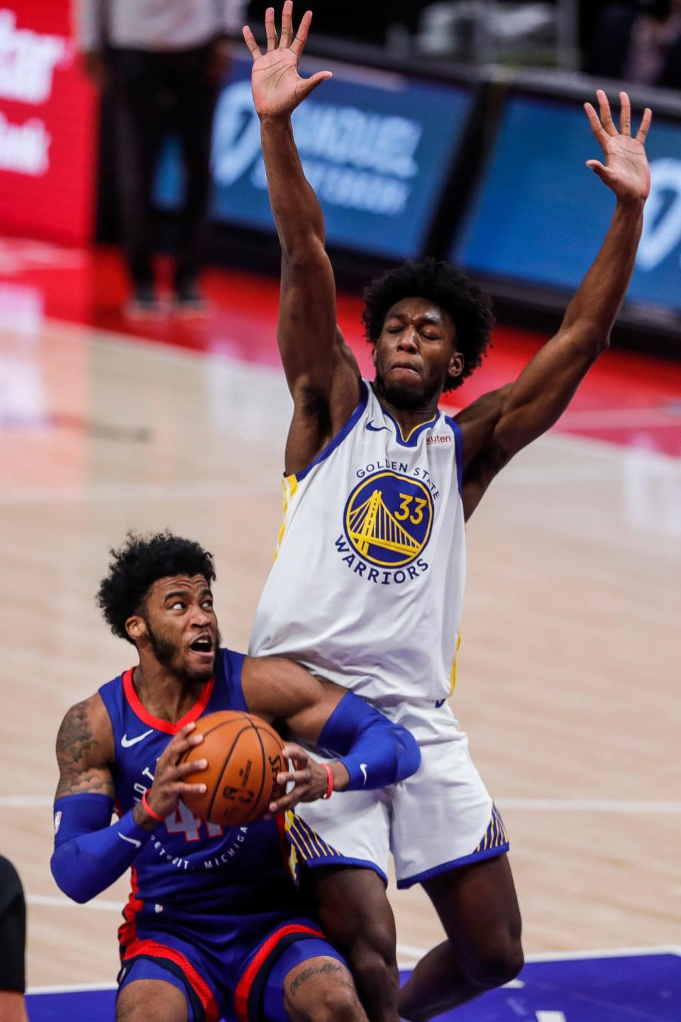 Pistons' Saddiq Bey is defended by Warriors' James Wiseman at Little Caesars Arena, Dec.  29, 2020.