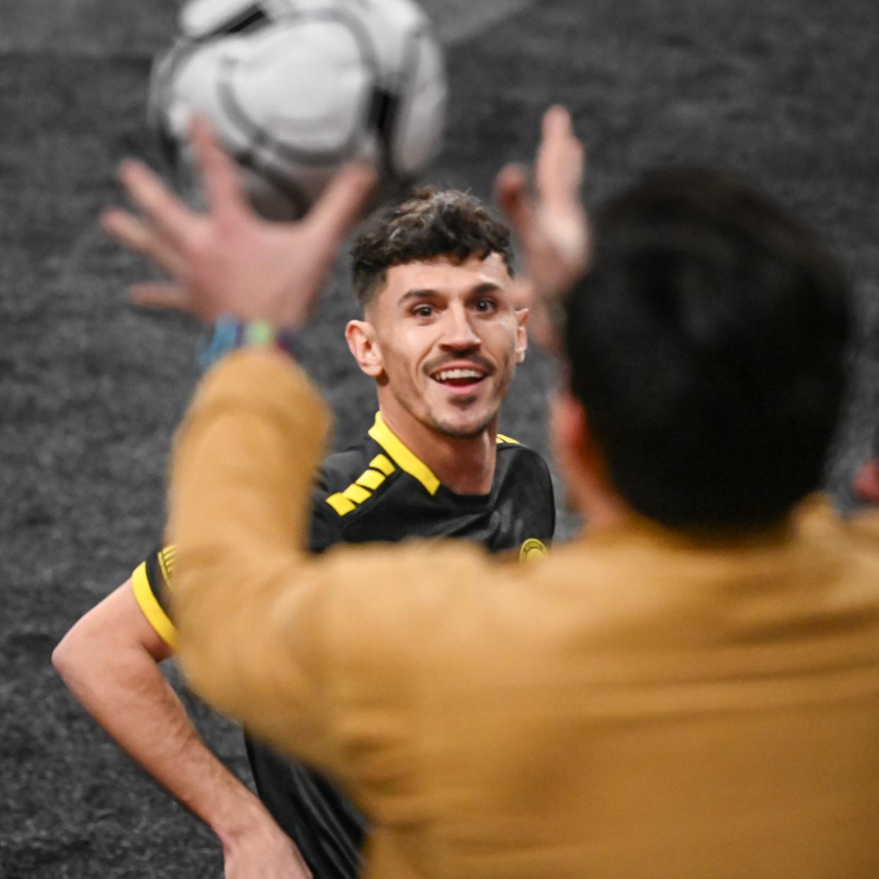 Wave defender Stuart Grable tosses a ball to a fan after scoring against Utica City FC in a game this season.