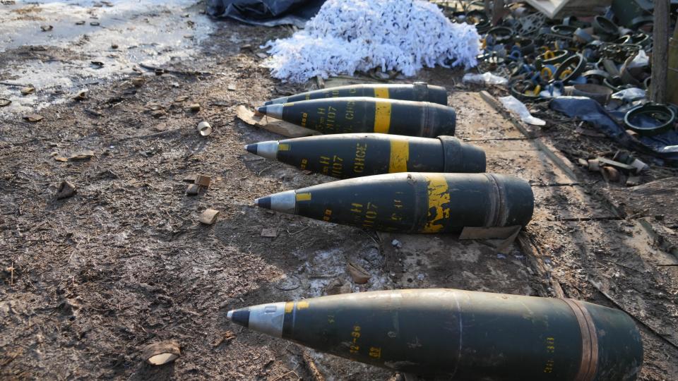 GPS-guided shells used by an American-made M777 howitzer are seen on the ground near the artillery weapon near a frontline position held by Ukraine's military on Feb. 11, 2023.