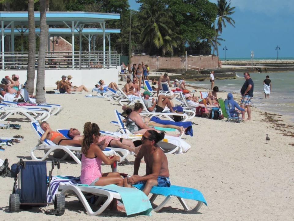 Visitors and locals enjoy Higgs Beach in Key West on Thursday, March 19, 2020.