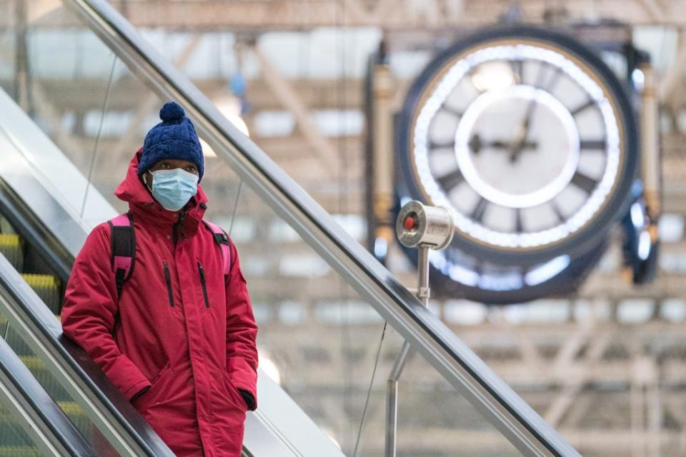 A passenger wearing a face mask at Waterloo station in London (Dominic Lipinski/PA) (PA Wire)