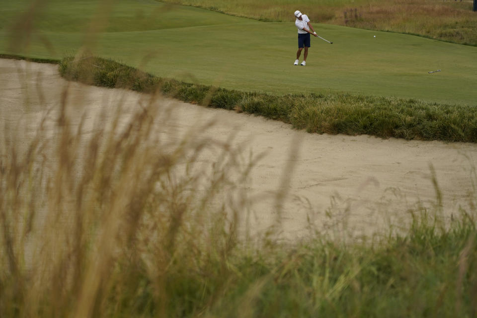 Collin Morikawa hits from the fairway on the eighth hole during a practice round for the U.S. Open Championship golf tournament at The Los Angeles Country Club on Wednesday, June 14, 2023, in Los Angeles. (AP Photo/Matt York)