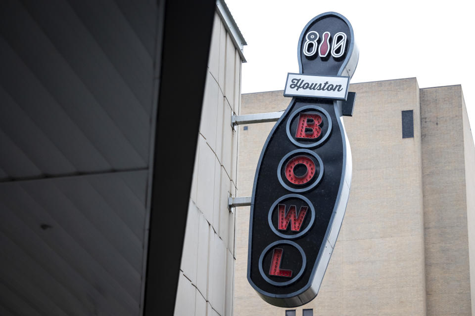 A sign for 810 Billiards & Bowling hangs from the side of building at 1201 San Jacinto, Tuesday, Nov. 1, 2022. The rapper Takeoff, best known for his work with the Grammy-nominated trio Migos, died after a shooting early Tuesday outside of 810 Billiards & Bowling in Houston, a representative confirmed. He was 28. (Annie Mulligan/Houston Chronicle via AP)