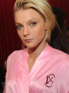 <p>Model Jessica Stam perfects her pout before taking to the runway for a rehearsal run ahead of the show.</p>