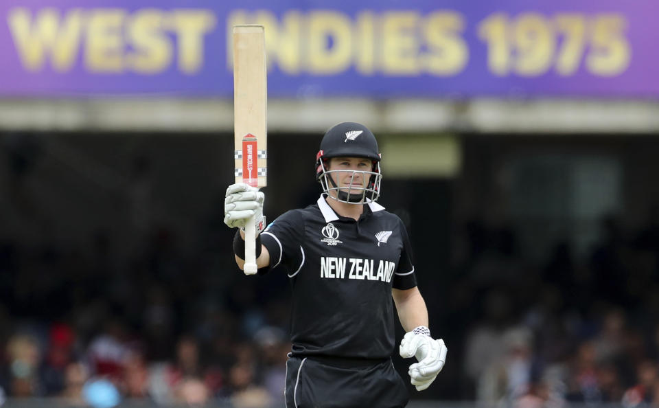 New Zealand's Henry Nicholls raises his bat to celebrate scoring fifty. (AP Photo/Aijaz Rahi)