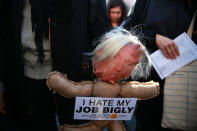 <p>A participant carries a Trump head on a stick at the “Mock Funeral for Presidents’ Day” rally at Washington Square Park in New York City on Feb. 18, 2017. (Gordon Donovan/Yahoo News) </p>