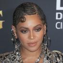 You know if Beyoncé's going to serve a protective style, it's going to be epic. For the premiere of <em>The Lion King</em> in 2019, her hair was braided in a curvy pattern reminiscent of finger waves. It was a beautiful marriage between two hairstyles so important to Black culture.
