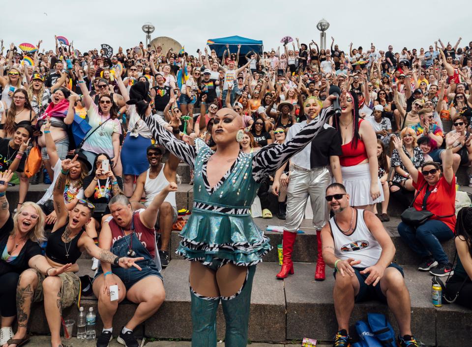 Tyler Cooper, of Detroit, aka Sabin interacts with the crowd while kicking off a drag show he put together on the main stage on Saturday, June 11, 2022, during the Motor City Pride Festival at Detroit's Hart Plaza.