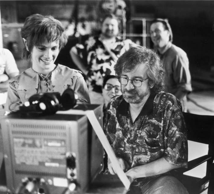 Actor Julia Roberts watches daily production footage with director Steven Spielberg on the set of his film "Hook" in 1991