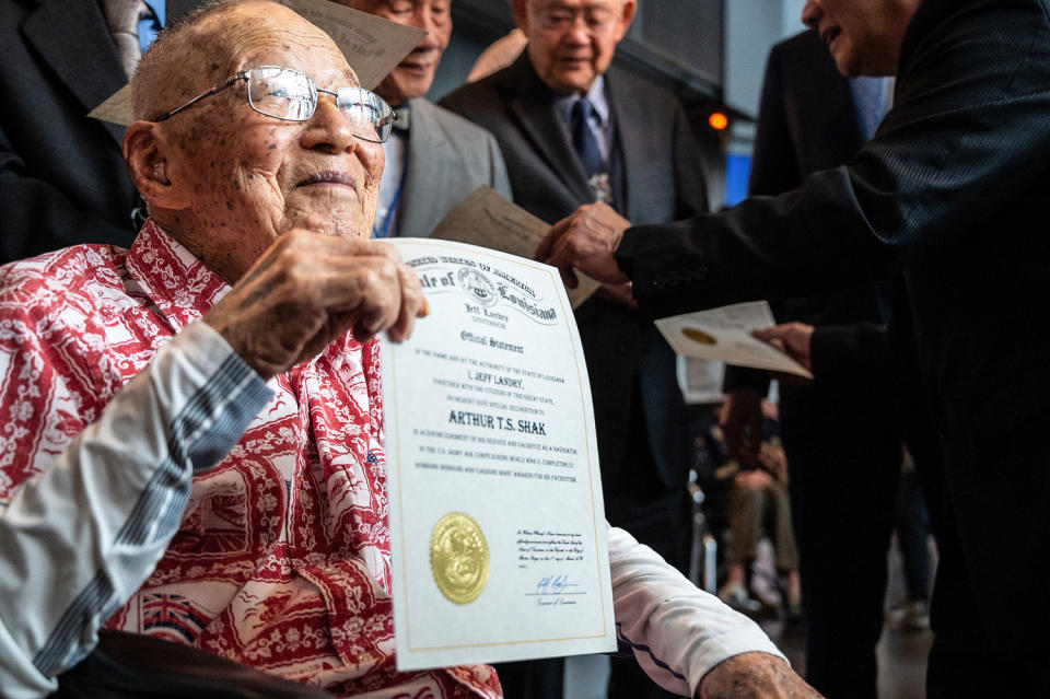 Arthur T.S. Shak, U.S. Army Air Corps, holds his certificate honoring the Congressional Gold Medals received by Chinese American World War II Veterans, on March 9, 2024 in New Orleans. (Frank L Aymami III / Courtesy of The National WWII Museum)